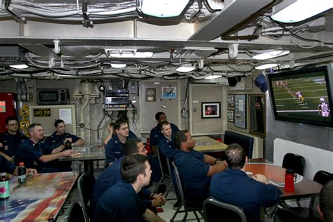 Crew members aboard USS Ohio (SSN 726) watch Super Bowl XLV while ...