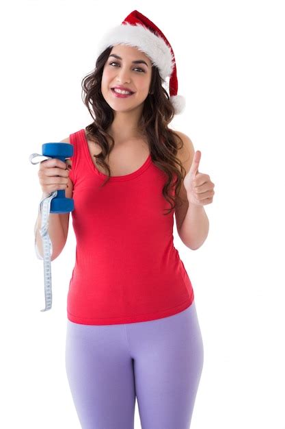 Premium Photo Festive Fit Brunette Holding Measuring Tape And Dumbbell