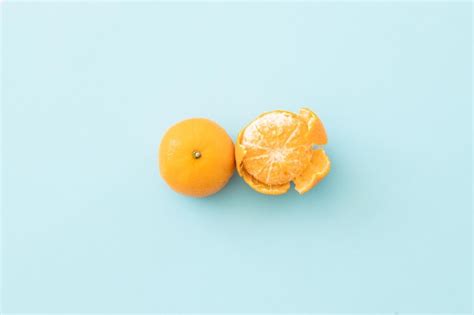 Premium Photo Clementine Mandarin On A Blue Background