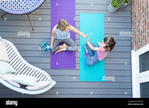 Overhead View Of Mother And Daughter Giving Each Other High Five After