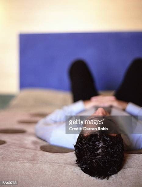 454 Man In Suit Lying On Bed Stock Photos High Res Pictures And