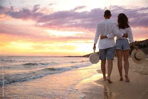 Couple Walking On A Beach - Couple Walking On The Beach At Sunset