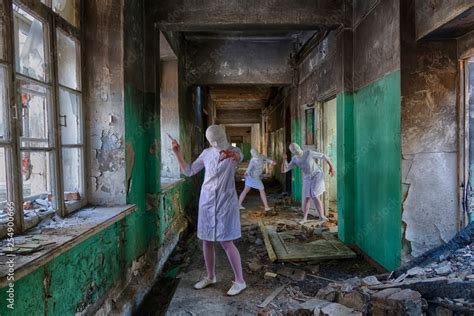 Three Identical Nurses Without Faces Head Bandaged Zombies With A