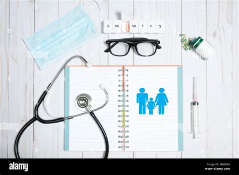 Workplace Of Doctor Stethoscope Notebook Medical Items And Pills On