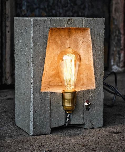 A Light Bulb Sitting On Top Of A Cement Block