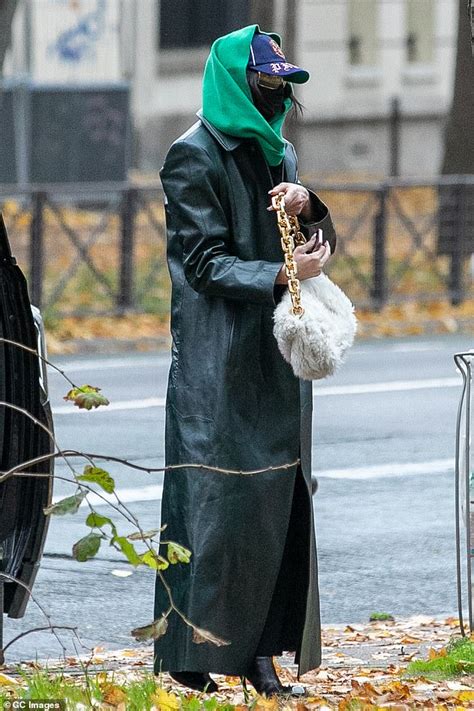 Dua Lipa Shields Behind A Face Mask And Sunglasses As She Arrives At