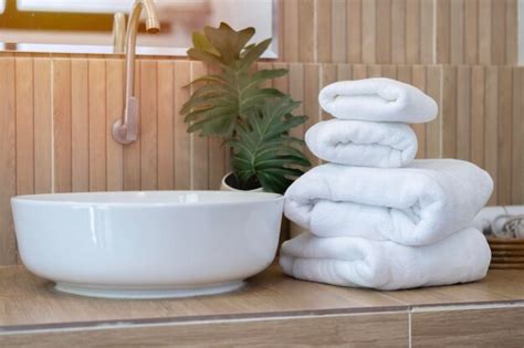 Premium Photo Stack Of White Clean Towels On On Countertop With