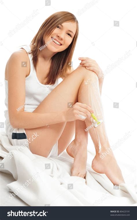 Cute Woman Shaving Her Legs Sitting Relaxed On Bed Stock Photo 80423191