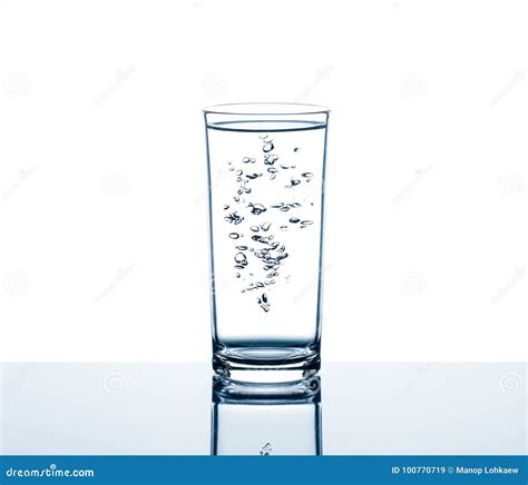 Drinking Water In Glass With Air Bubbles On Reflection Glass Table On White Background Stock