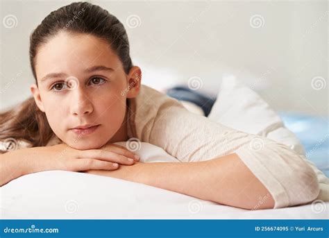 A Day In The Life Of A Teen A Teenage Girl Lying On Her Bed Looking