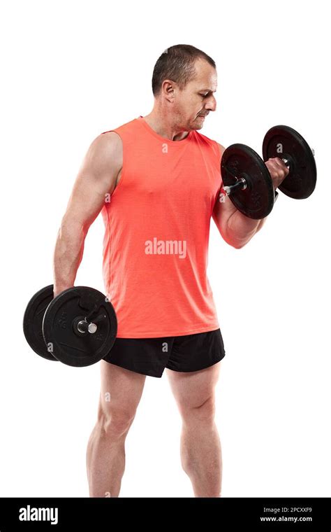 Mature Athletic Man In Pink Tee Doing Fitness Workout With Dumbbells