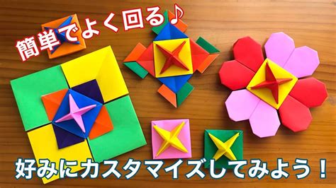 Some Origami Flowers And Other Items On A Wooden Table With Japanese