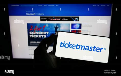 Person Holding Smartphone With Logo Of Us Company Ticketmaster