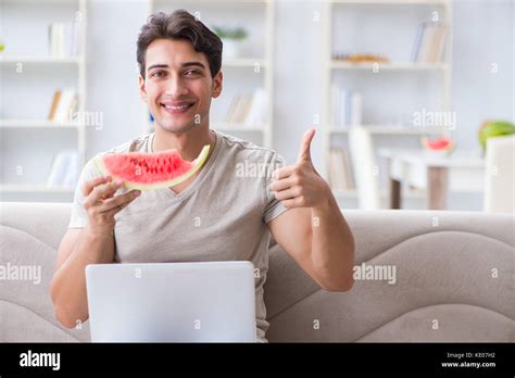 Man Eating Watermelon At Home Stock Photo Alamy