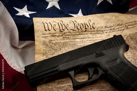 The Second Amendment And Gun Control In America Concept With A Handgun