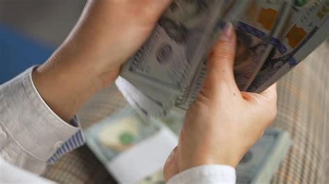 Woman Counting Us Dollar Bills Or Paying In Cash Stock Video