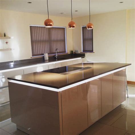 Undercounter Lighting And Bold Copper Accents Allow Silestone To Shine In This Kitchen By John