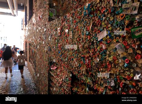 Tourists Visiting The Gum Wall At Post Alley Under Pike Place Market