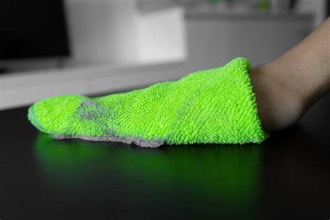 Cleaning the House. Wipe Off the Dust with a Green Rag from a Dirty ...