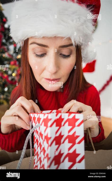 Mature Woman Christmas Gift Looking Hi Res Stock Photography And Images
