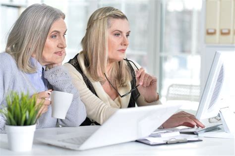 Two Excited Mature Women Working In Office Stock Image Image Of Devices Caucasian