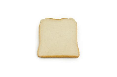 Premium Photo Close Up Of Bread In Plate Against White Background