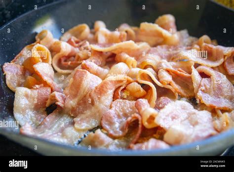 Bacon Sizzling In A Pan Stock Photo Alamy