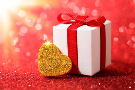 Premium Photo Gold Heart And T Box On Glitter Red Background