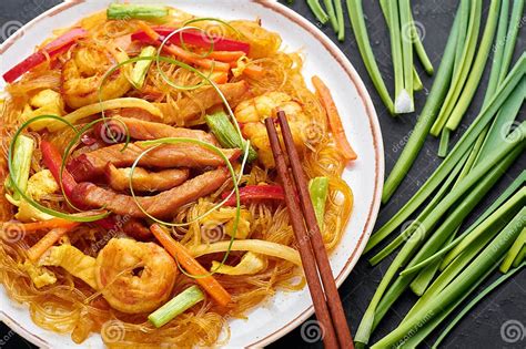 Singapore Mei Fun In White Plate On Dark Slate Background Singapore Noodles Is Chinese Cuisine