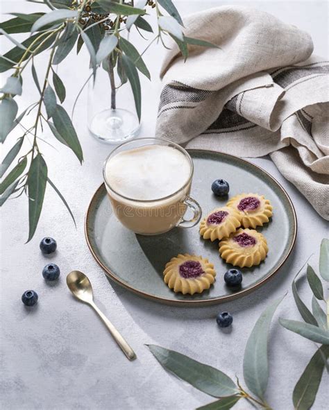 Cappuccino Or Latte With Milk Foam In A Cup With Homemade Berry Cookies