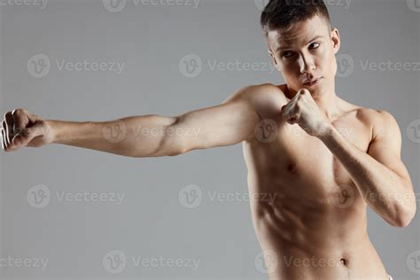 Guy Are Boxing On Gray Background And Naked Torso Muscle Bodybuilder