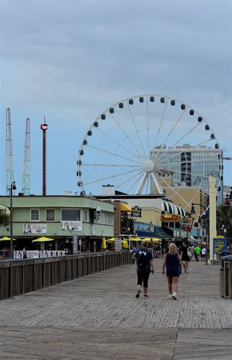 Walking On The Boardwalk To The Sky Wheel In Myrtle Beach Editorial