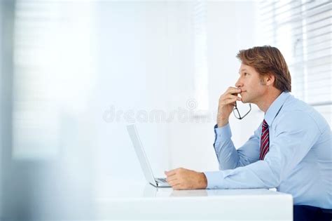 Forward Thinking Business A Mature Businessman Thinking While Sitting