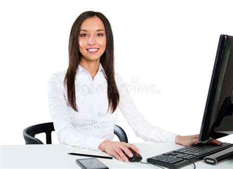 Portrait Of A Young Business Woman Using Computer At Office Stock Photo