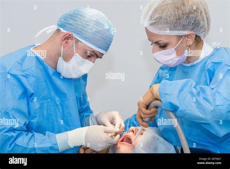 Dentists During Surgery For Implant Placement Stock Photo Alamy