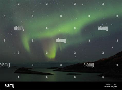 Northern lights over fjords Stock Photo - Alamy