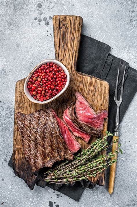 BBQ Grilled Wild Venison Steak On Wooden Board Gray Background Stock