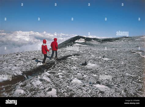 Sicily - Etna Natural Park. Hikers in the crater of Etna Stock Photo ...