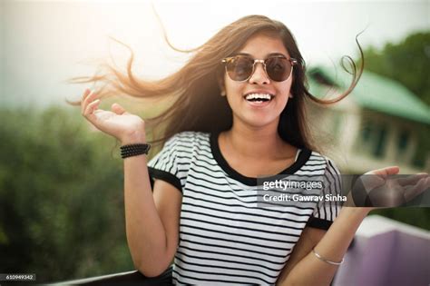 Beautiful Girl Wearing Sunglasses Enjoying Fresh Air In Balcony High