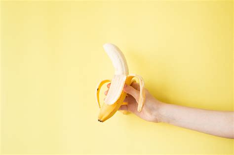 Human Hand Holding Banana Fruit Nutrition Concept Stock Photo