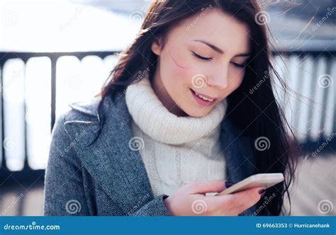 Pretty Brunette Using Her Touch Screen Smart Phone Stock Image Image Of Modern Device