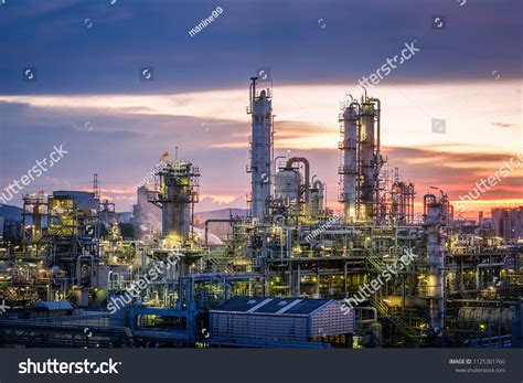 Oil And Gas Refinery Plant Or Petrochemical Industry On Sky Sunset