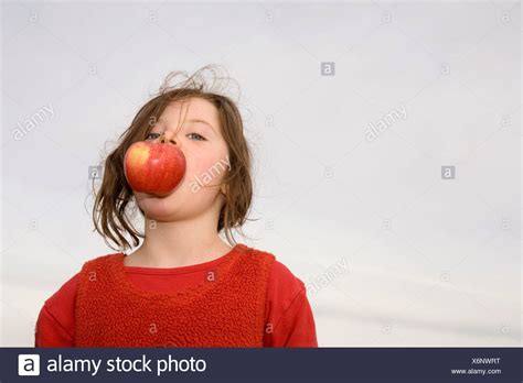 Apple In Mouth Stock Photos And Apple In Mouth Stock Images Alamy