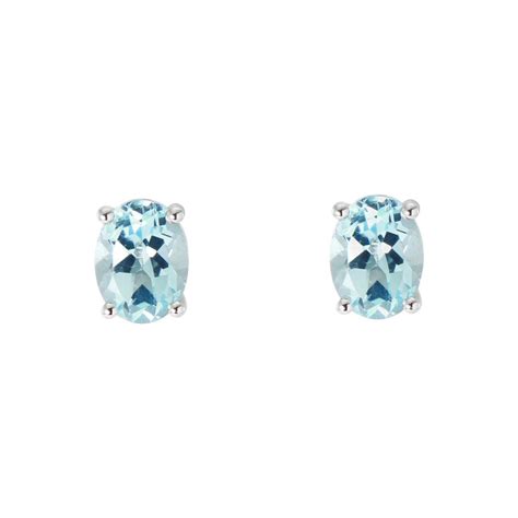 Boucles d oreilles Or Blanc 750 Topaze bleue traitée Ovale 8x6mm Ref 47182