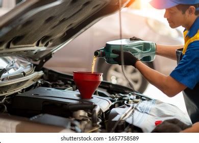 Pouring Oil Car Engine Mechanic Pouring Stock Photo 1657758589