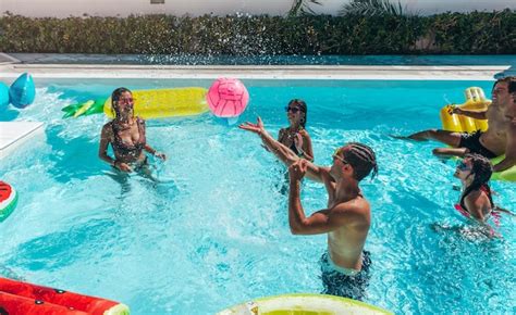 Premium Photo Group Of Friend Play Together In The Swimming Pool