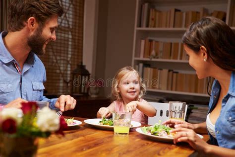 Family Eating Dinner at a Dining Table Stock Photo - Image of drink ...