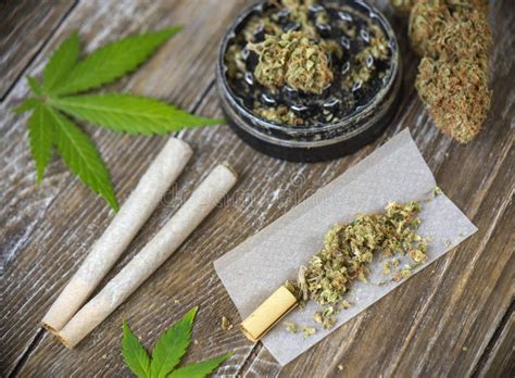 Cannabis Joints With Rolling Paper And Grinder Stock Photo Image Of