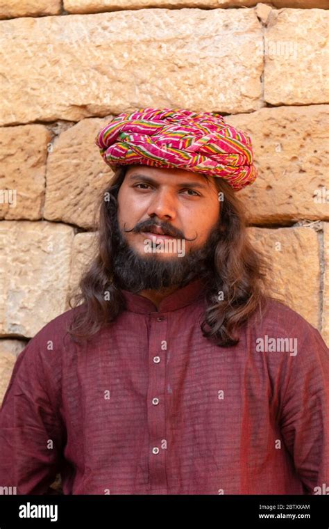 Portrait Of A Man From Jaisalmer Standing In The Thar Desert With