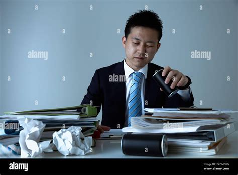 Tired Japanese Businessman Stock Photo Alamy